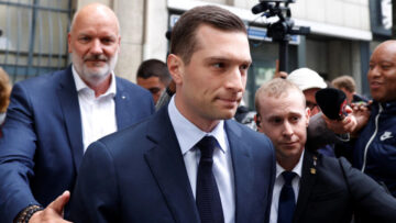 Jordan Bardella leaves the Rassemblement National party headquarters in Paris